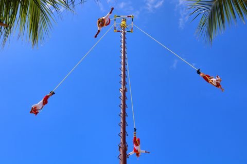 Voladores (Papantla flyers) performing at the port