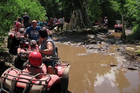 ATVs on a muddy jungle track on Cozumel