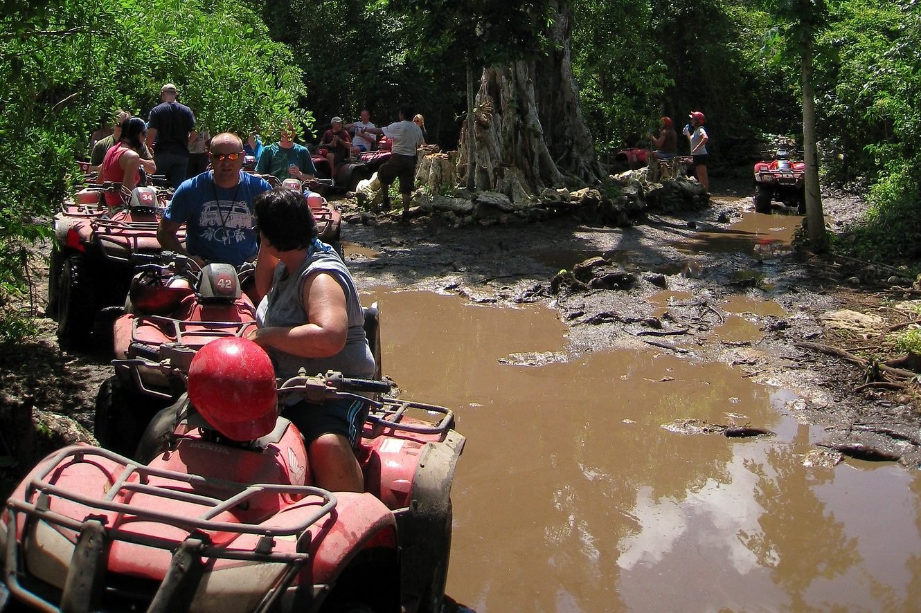 ATVs on a muddy jungle track on Cozumel