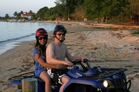 Riding an ATV along a Roatan beach