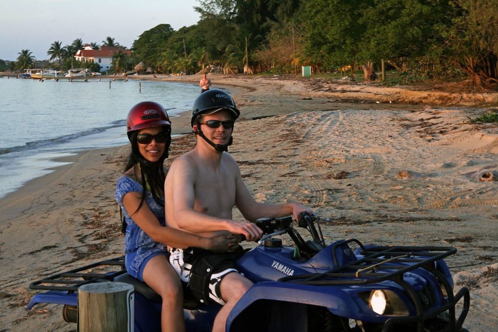 Riding an ATV along a Roatan beach